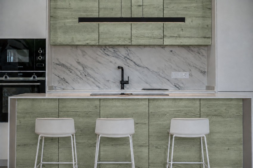 AI visualisation of the kitchen with sage green detailing.