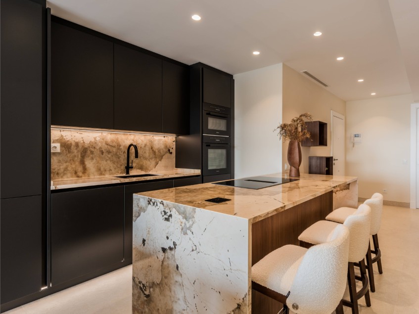 Modern renovated kitchen in Costa del Sol property Open-plan renovated kitchen with contemporary design and integrated appliances in a Costa del Sol home.
