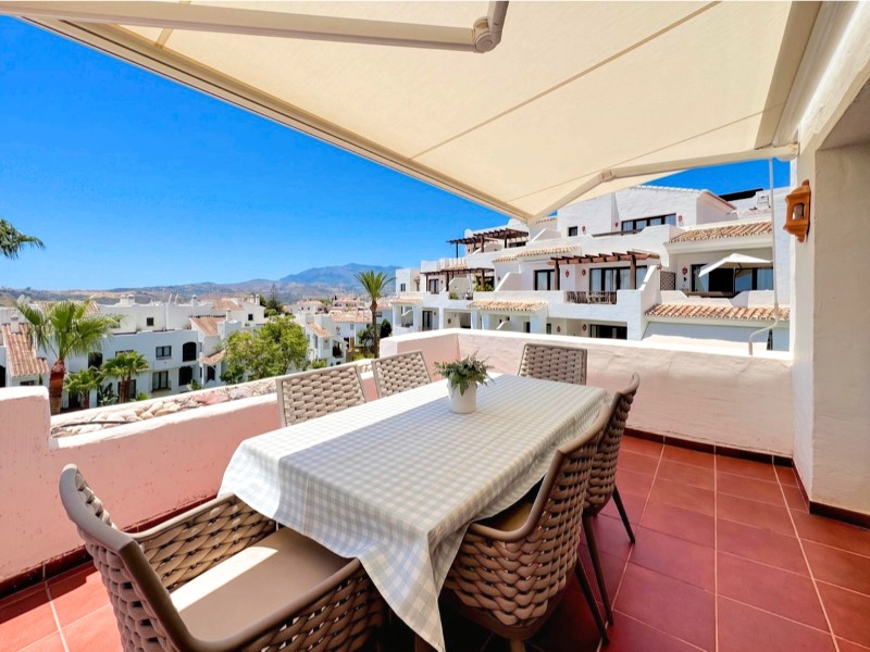 Family dining in a four-bedroom penthouse Family-sized dining terrace in single homes at Mijas Golf.