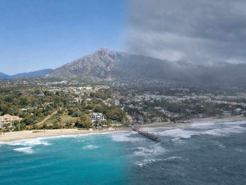 Contrastes côtiers, soleil et tempête Contrastes côtiers sur la Costa del Sol, avec du soleil dans une zone et des nuages orageux dans une autre.